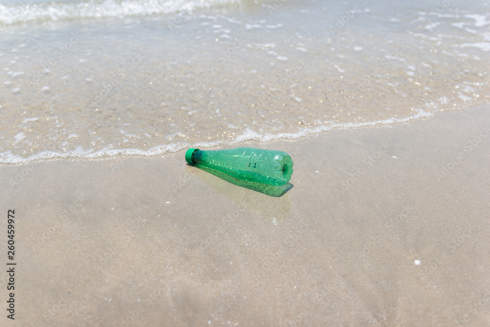 garbage and plastic bottles and dirty waste on a beach Asia Thailand. garbage and plastic bottles and dirty waste on a beach Asia Thailand.