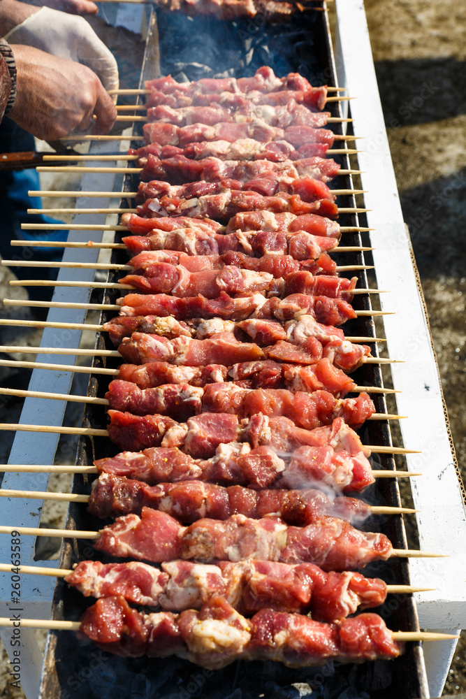 Marinated meat is roasted on the coals in the barbecue