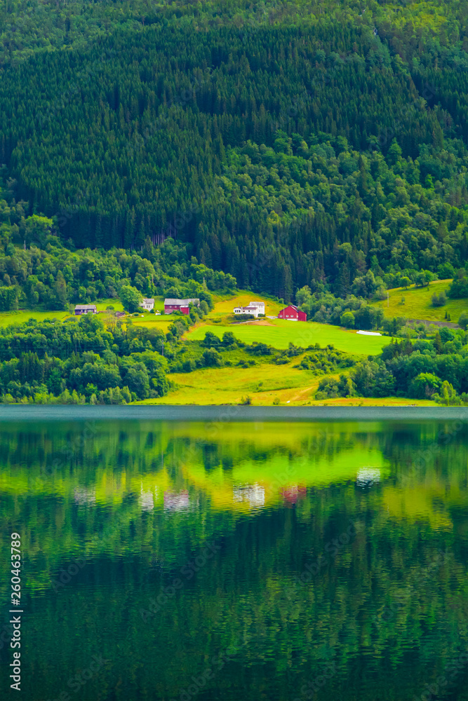 Village is located on the green slopes near lake. Village is located on the green slopes near lake.
