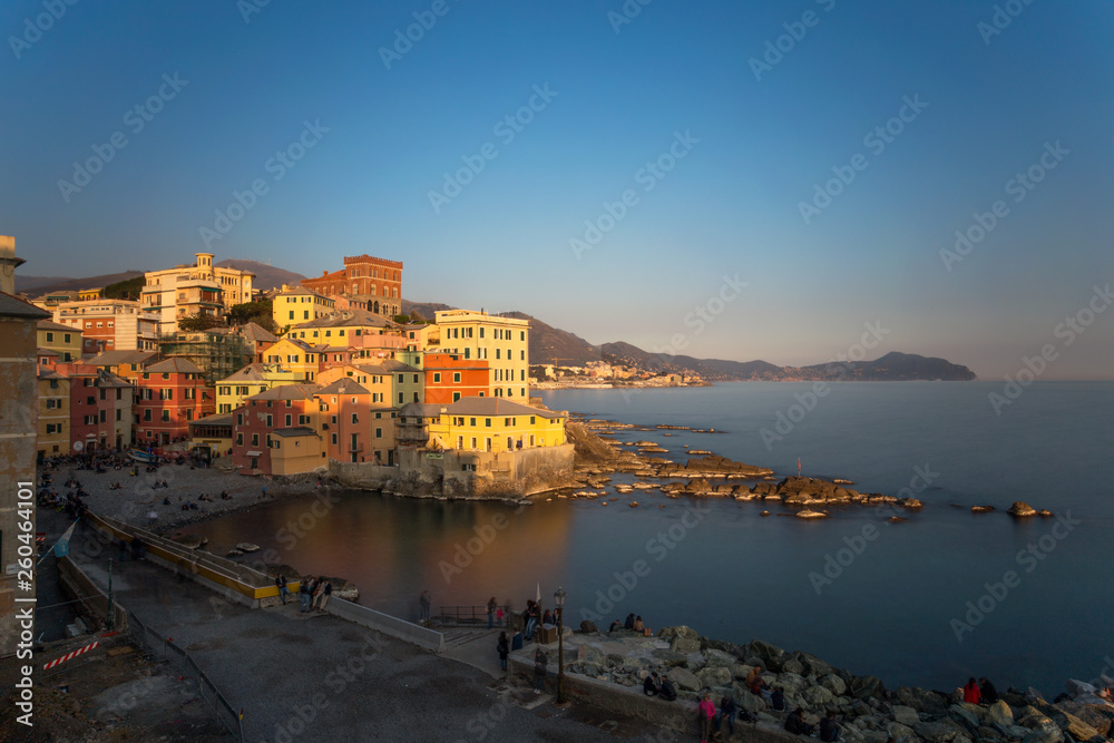 GENOA, ITALY, MARCH 23, 2019 - View of Genoa Boccadasse at sunset,  a fishing village with colorful houses in Genoa, Italy.