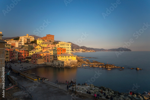 GENOA, ITALY, MARCH 23, 2019 - View of Genoa Boccadasse at sunset,  a fishing village with colorful houses in Genoa, Italy. © faber121