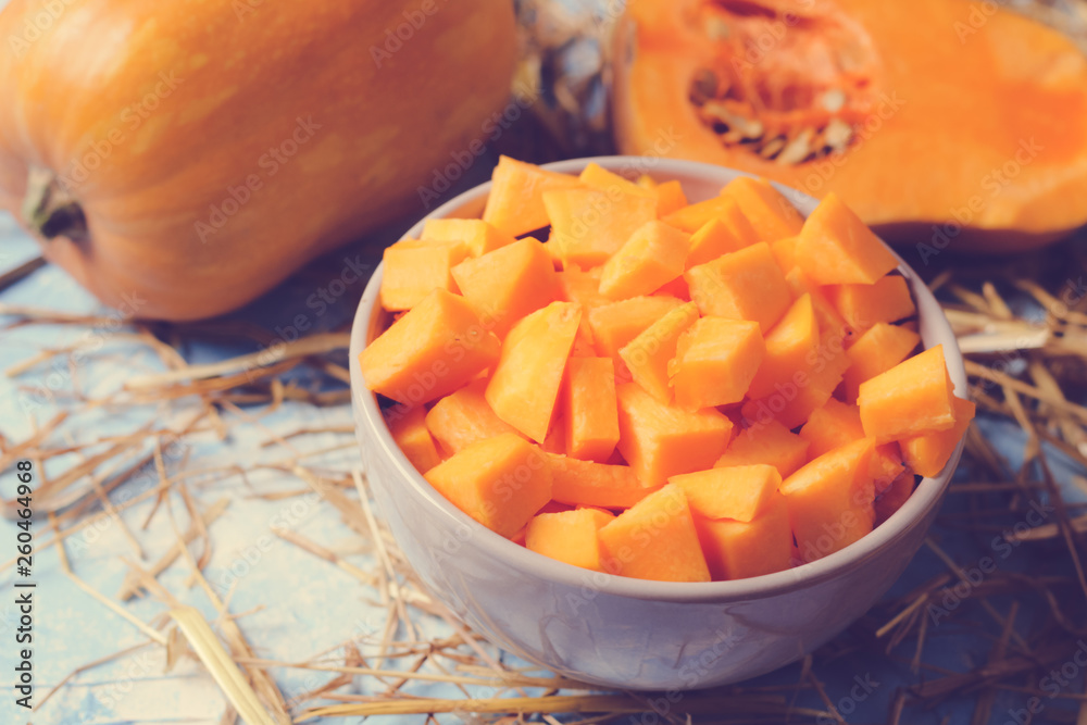 ingredients for pumpkin soup on a wooden background ingredients for pumpkin soup on a wooden background