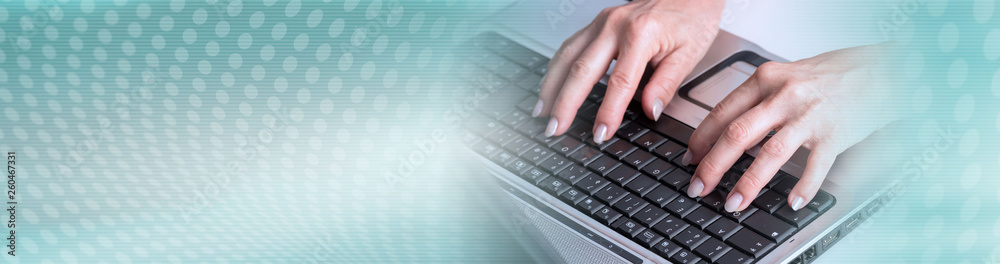 Hands typing on a laptop keyboard. panoramic banner Hands typing on a laptop keyboard. panoramic banner