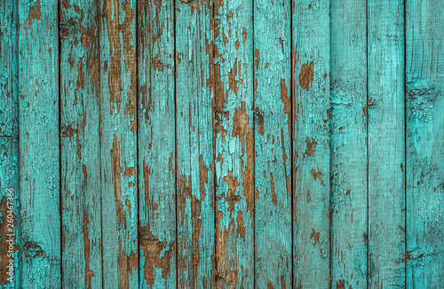 Blue painted plank fence with cracked and scratch. Horizontal grunge texture