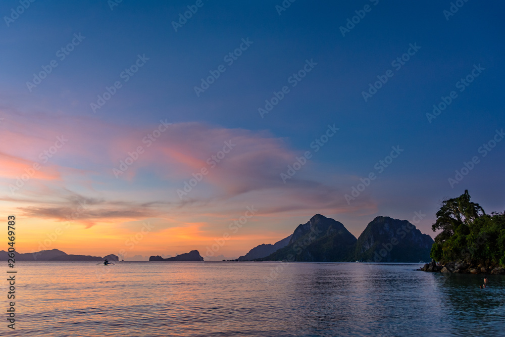 Tropical sunset landscape. El Nido Philippines, Palawan - Las Cabanas Beach