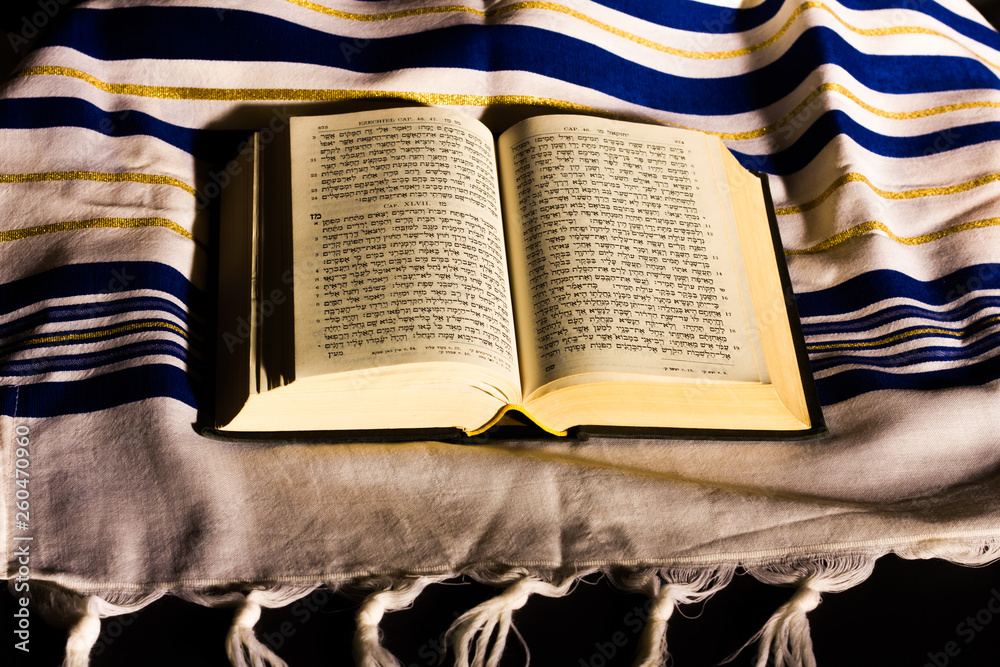 Hebrew prayer book and a tallit, a jewish prayer shawl Stock Photo