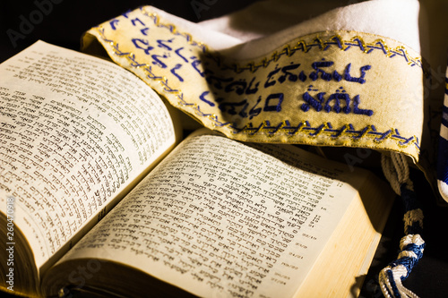 Hebrew prayer book and a tallit, a jewish prayer shawl photo