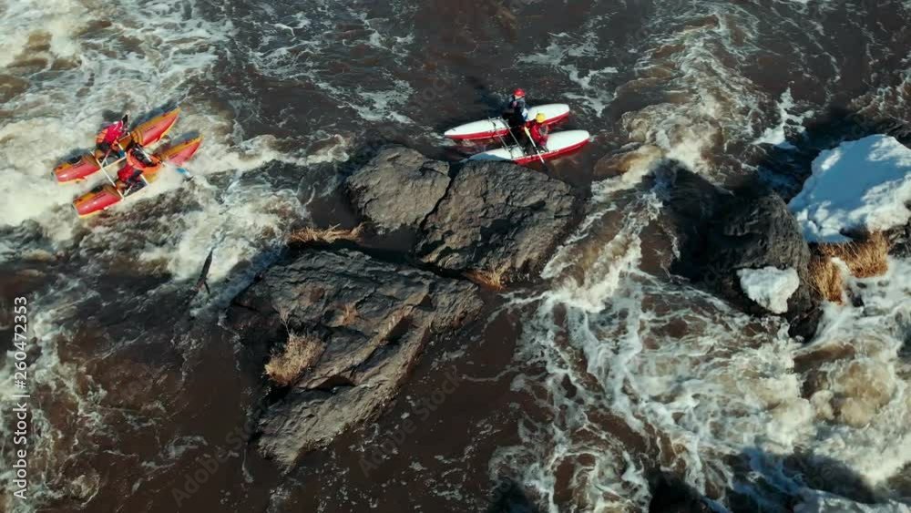 Rafting on Catamaran on a mountain river, aerial view Rafting on Catamaran on a mountain river, aerial view