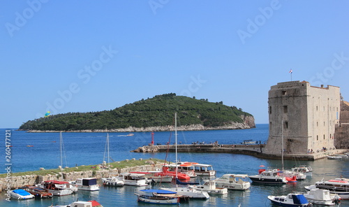 Dubrovnik Croatia, Lokrum island in front of old town harbour with boats and fort st Ivana