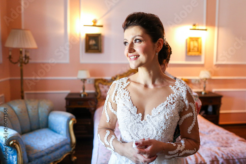 Beautiful bunette bride posing in hotel room © hreniuca