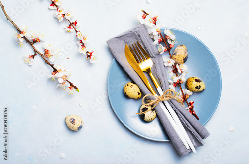 Easter Table Setting with Quail Eggs and Branches in Blossom, Spring Holidays Background