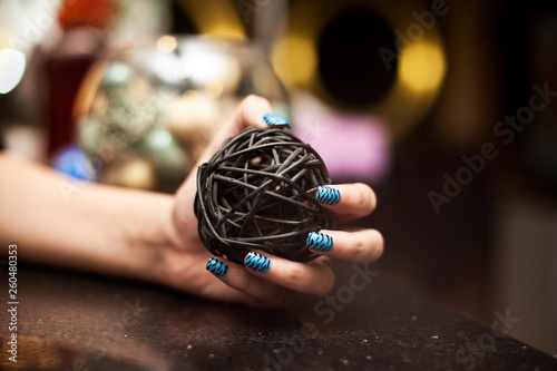 Ball in hand with nail art fashion salon