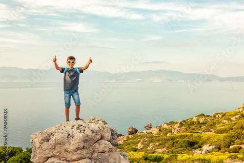 Young boy traveling along the coast of the Mediterranean Sea.