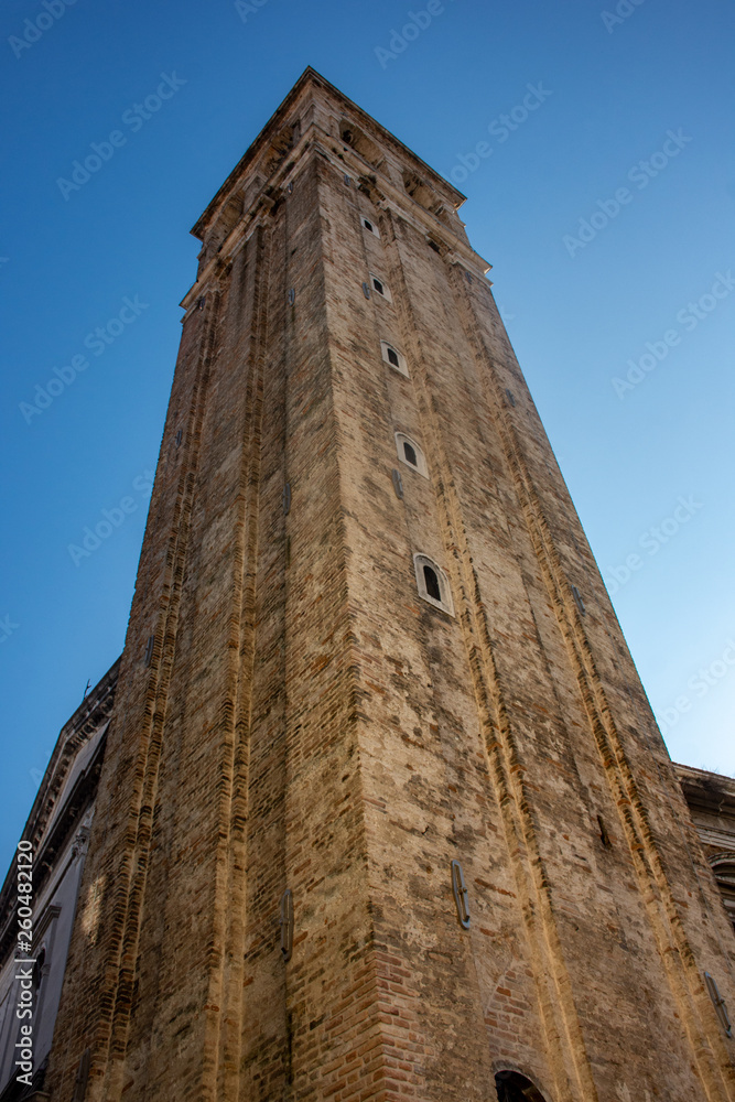 Italy, Venice, ancient tower in a town square.