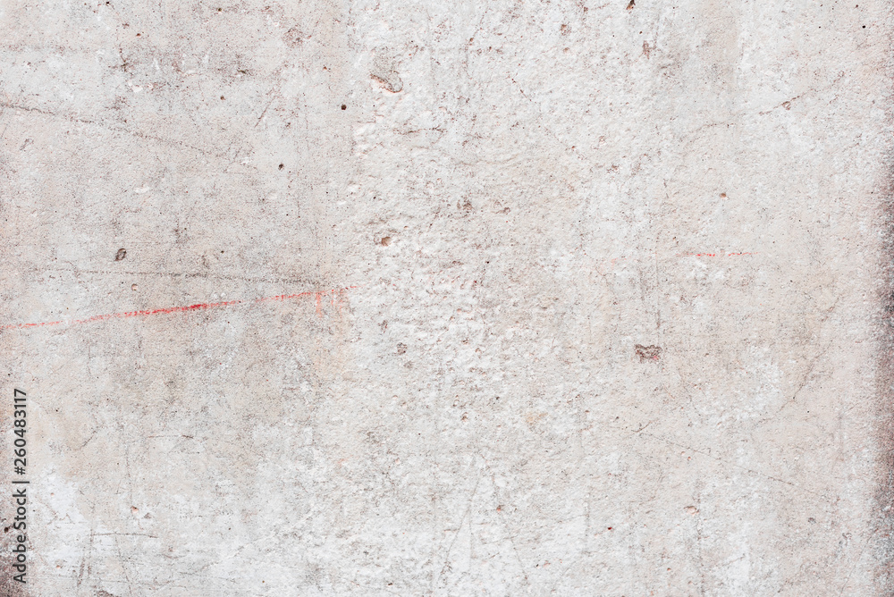 Fototapeta premium Wall fragment with scratches and cracks
