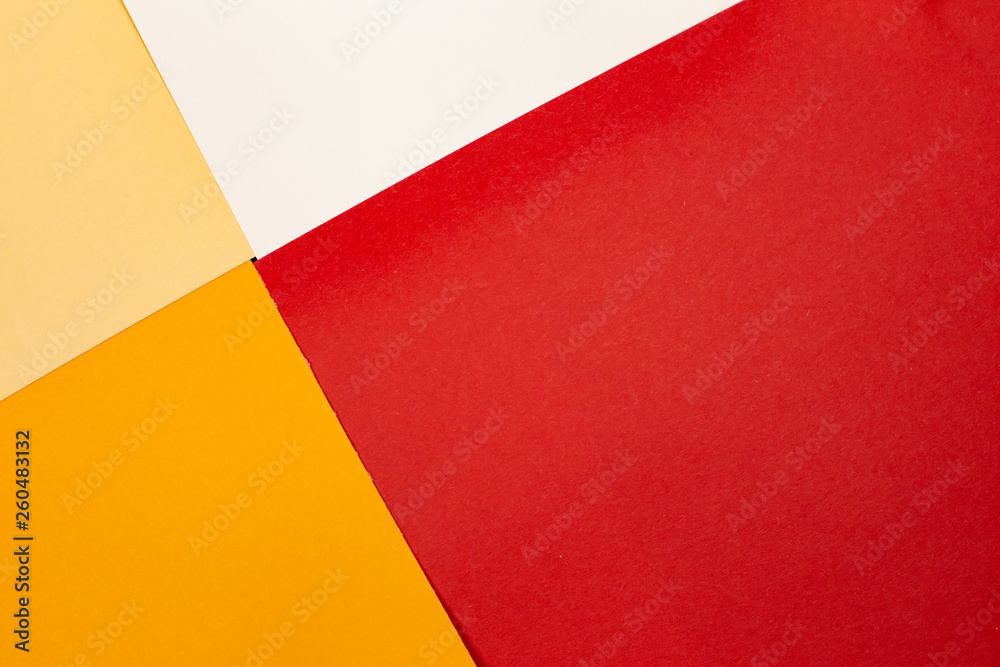 sheets of colored paper. Many colored sheets of paper are laid out in the harsh composition. background of colored paper. warm colors