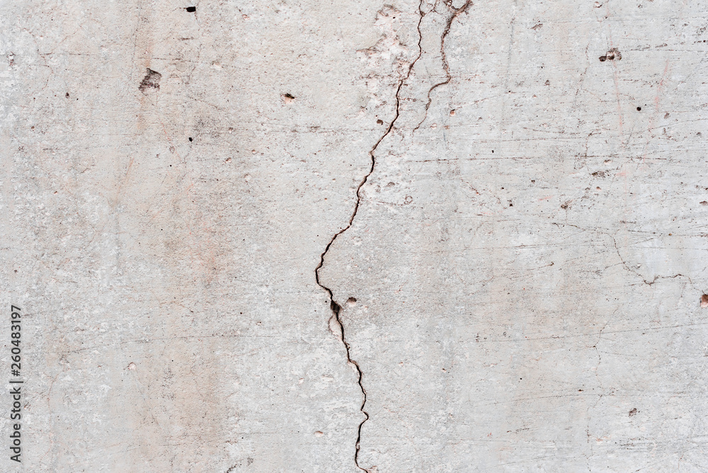 Fototapeta premium Wall fragment with scratches and cracks