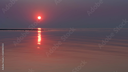 sunset in sea. © Ivars