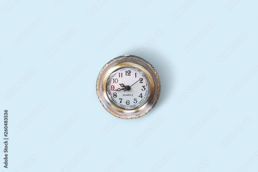 A watch isolated on light blue background A watch isolated on light blue background