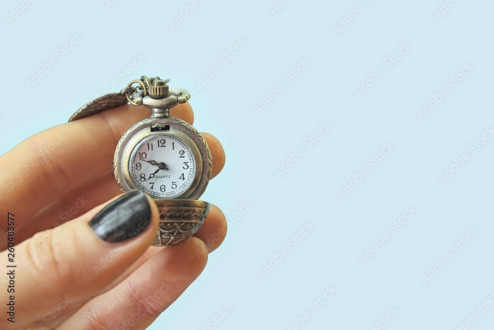 A watch isolated on light blue background A watch isolated on light blue background
