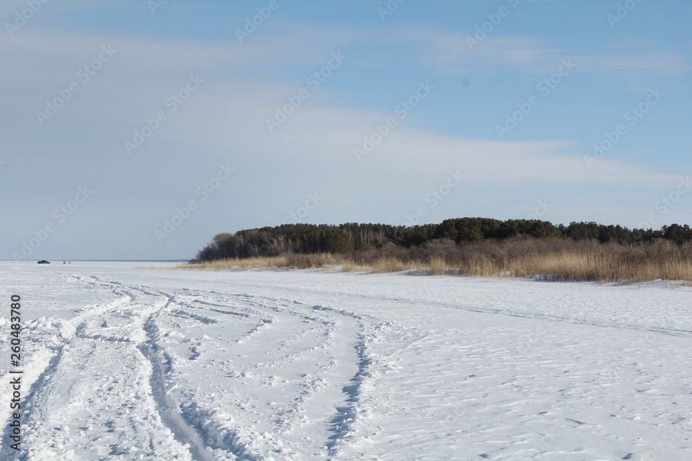 Car tracks on a frozen lake