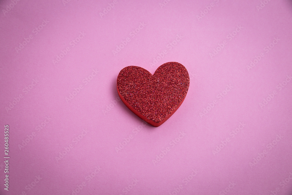 top view of a heart against pink background