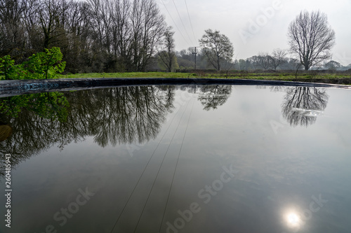 Fototapeta Naklejka Na Ścianę i Meble -  dawn reflections in water tank