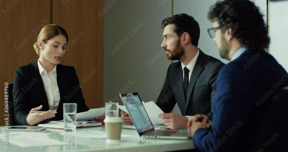 Male and female business people having business meeting in the cozy modern office, talking and consulting. Male and female business people having business meeting in the cozy modern office, talking and consulting.