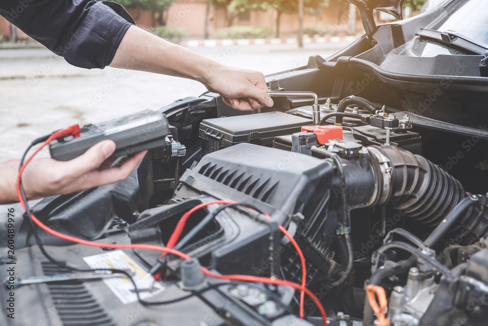 custom made wallpaper toronto digitalServices car engine machine concept, Automobile mechanic repairman hands repairing a car engine automotive workshop with a wrench and digital multimeter testing battery, car service and maintenance