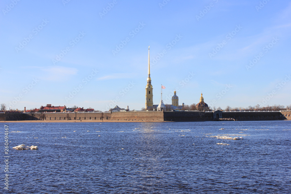 Peter and Paul Fortress on Hare's island in St. Petersburg, Russia. Panoramic outdoor view on spring day with ice floating on Neva river