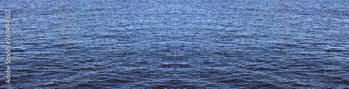 Water surface elongated horizontal banner. River or sea water pattern with small waves