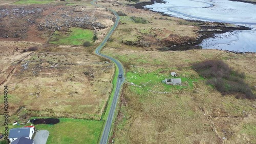 Aerial view of car driving at the coastline by Marameelan south of Dungloe, County Donegal - Ireland photo