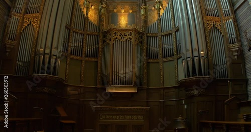 interior of an old church organ alter stained glass dolly