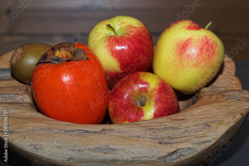 Close-up of fruits in a wooden bowl