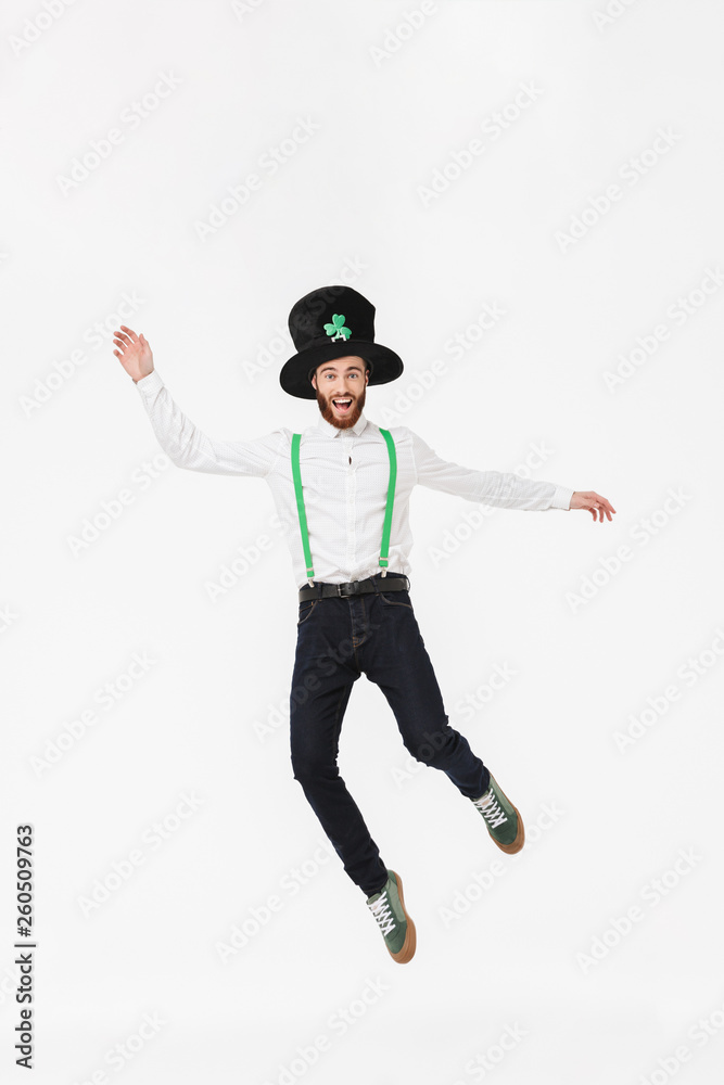 Full length of a cheerful young man celebrating