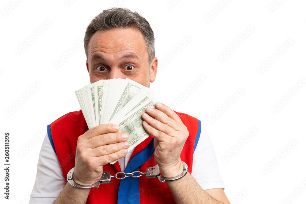 Supermarket employee holding money in front of mouth. Supermarket employee holding money in front of mouth.