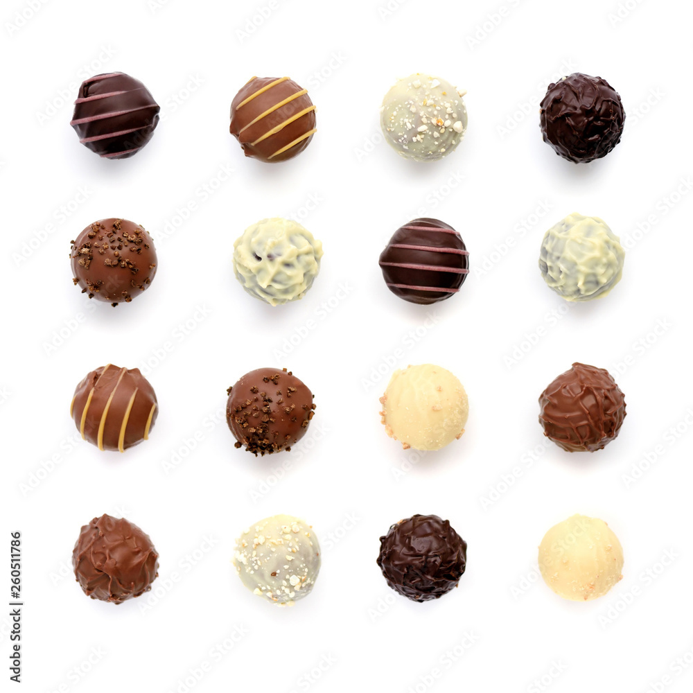 Top view of various chocolate pralines isolated on white background - obrazy, fototapety, plakaty 