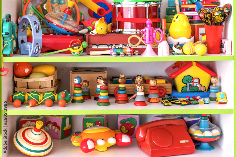 plastic and wooden retro toys on the shelf