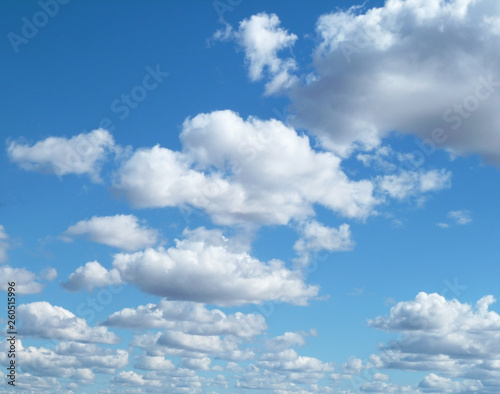 Blue sky with white clouds. Beautiful sky background. Clear day and good weather. 