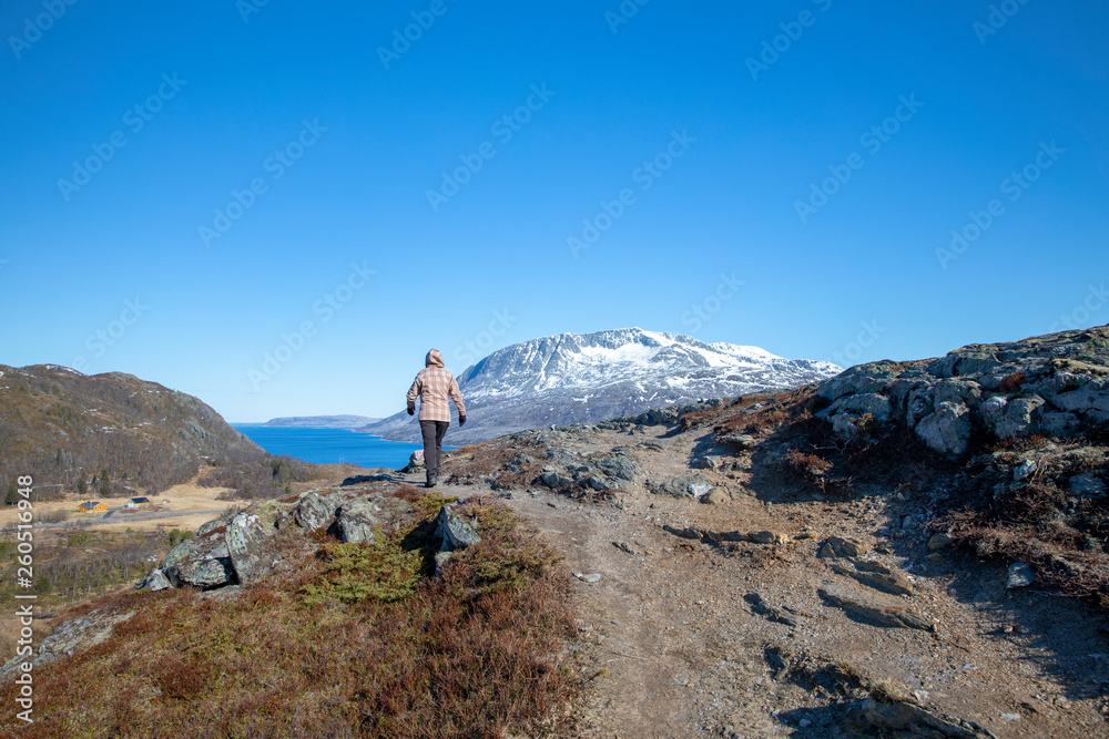  Woman walking in the mountains