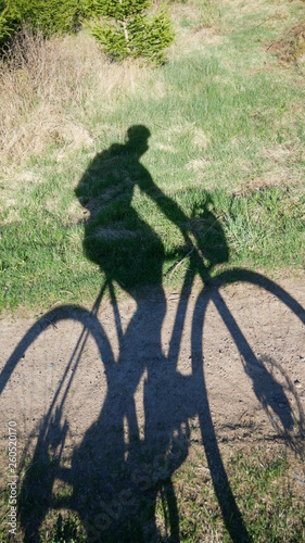 person riding a bike shadow