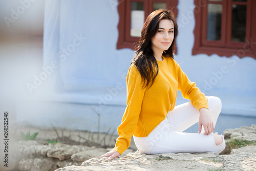 Beauty fashion portrait of young beautiful brunette girl with long black hair and green eyes. Beauty portrait of female face with natural skin. © romeof