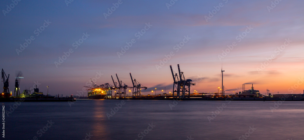 Panorama of container port in Hamburg, Germany at night