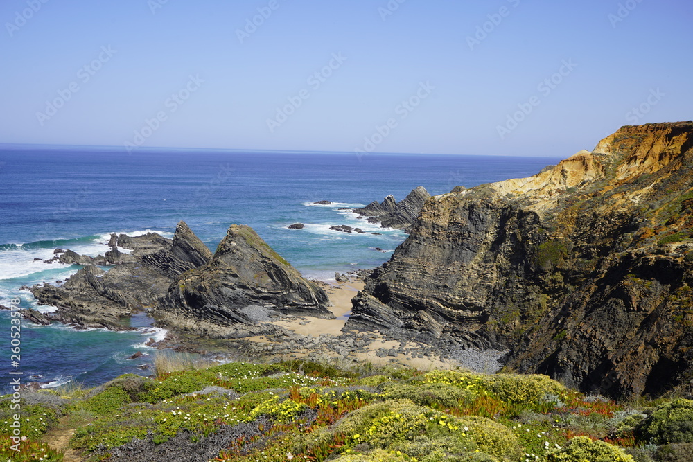 Green cliffs and the sea, rock formations in the water, Rota Vicentina, Alentejo, Portugal