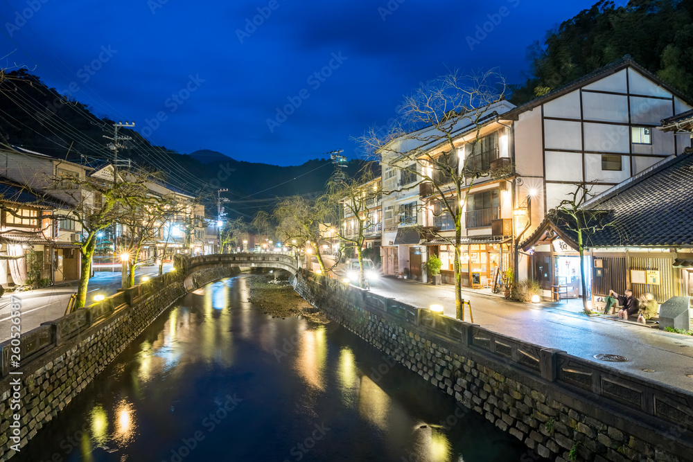 The river and ancient stone bridge in Kinosaki Onsen Hyogo Province, Japan.