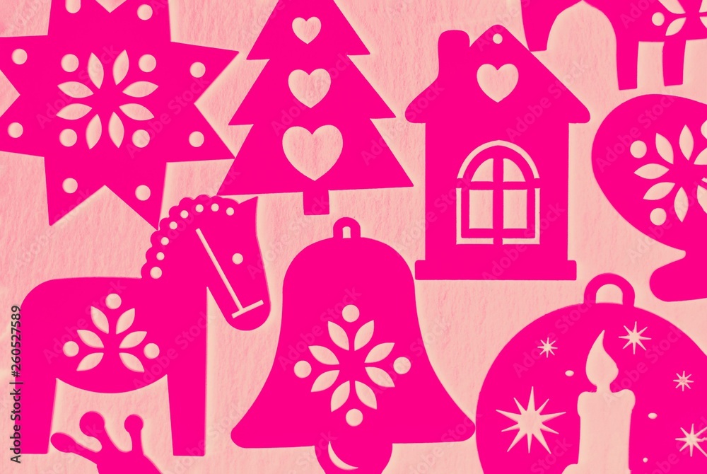 Pink magenta Christmas decorations on a coral background