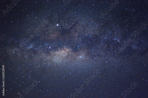 Clearly milky way galaxy during summer, background of beautiful milky way. Long exposure photograph with grain. Image contain certain grain or noise and soft focus. © Adanan