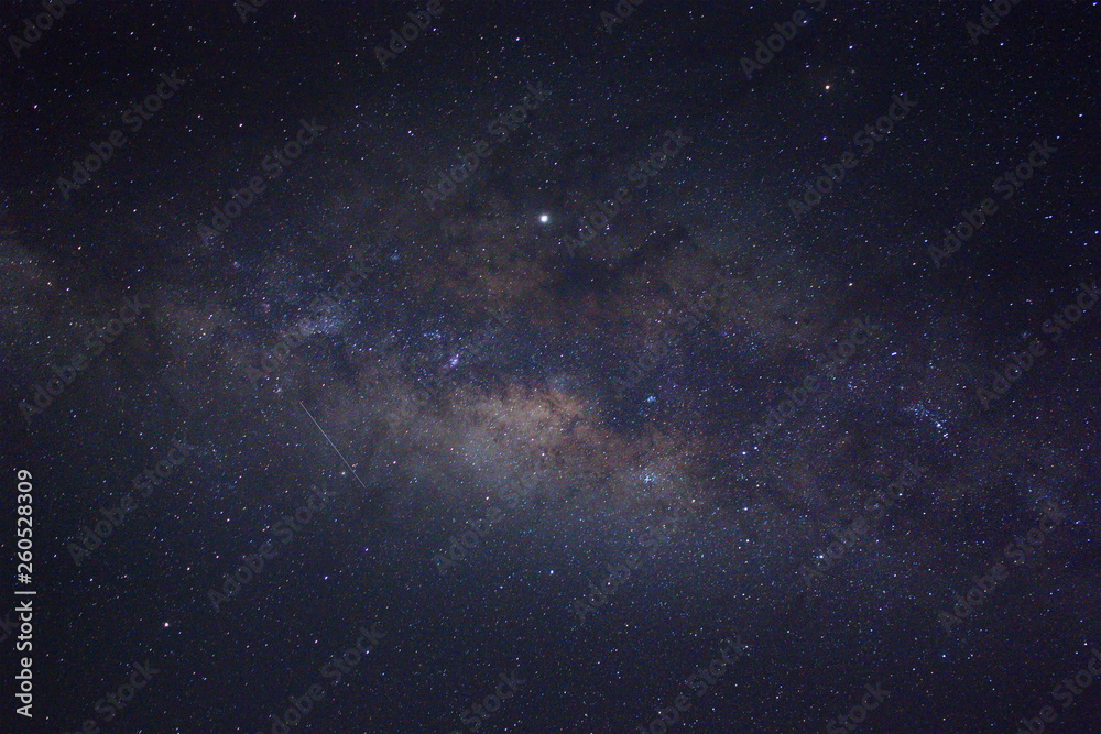 Clearly milky way galaxy during summer, background of beautiful milky way. Long exposure photograph with grain. Image contain certain grain or noise and soft focus.