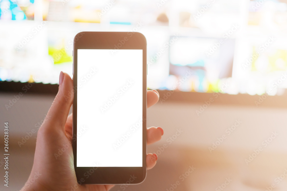 Phone in girl's hand, white screen Phone in girl's hand, white screen