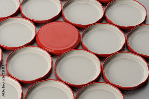 Screw caps for glass jars. For canning, canned food. Red caps on gray background flip covers